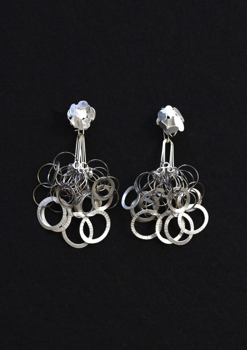 Two silver pendant earrings made of rings of silver by a New Designers winner