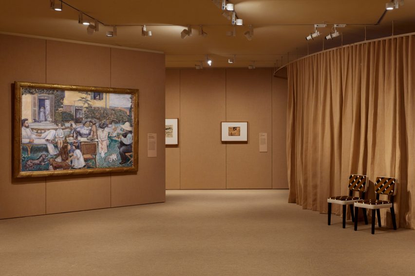 Entirely brown gallery featuring a large painting