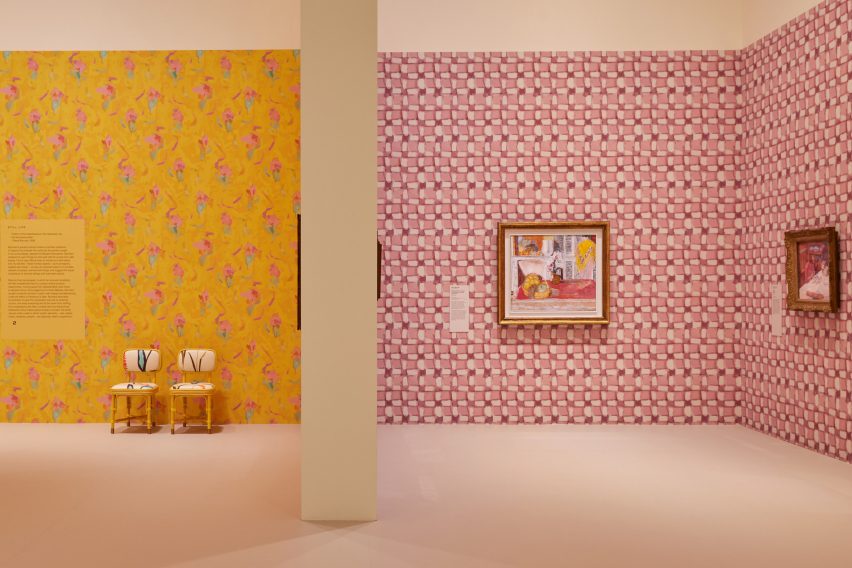Two gallery spaces: one with yellow walls and the other pink