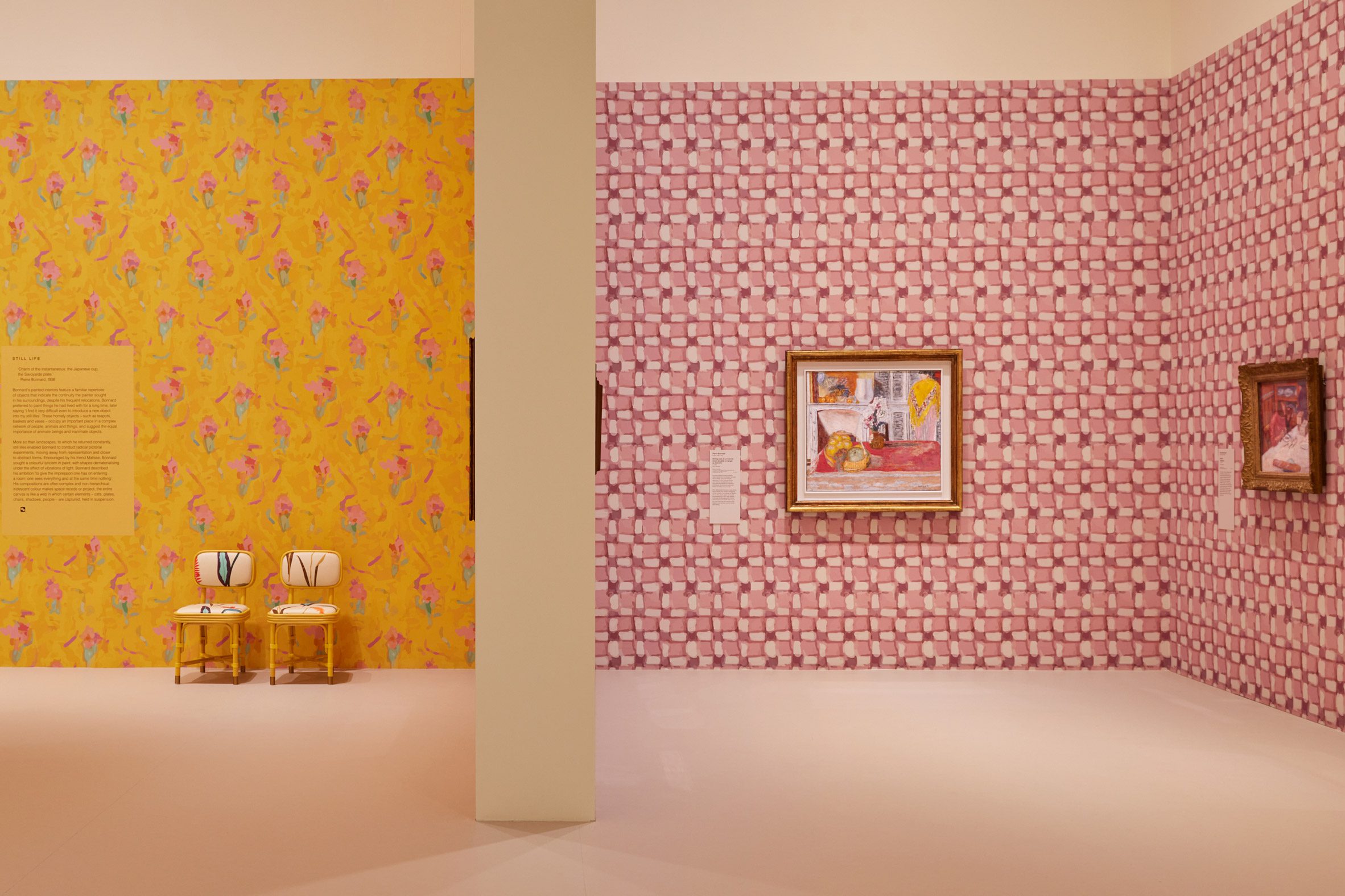 Two gallery spaces: one with yellow walls and the other pink