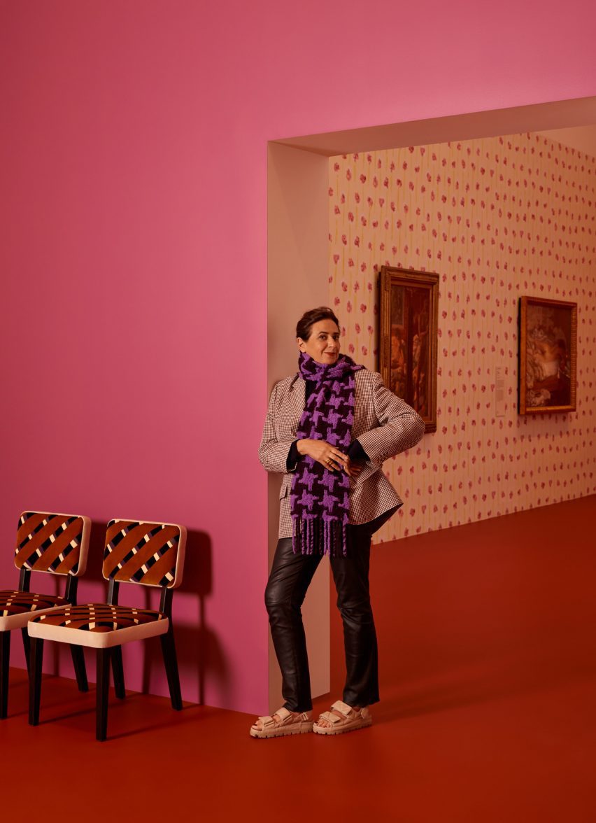 India Mahdavi posing in a pink room