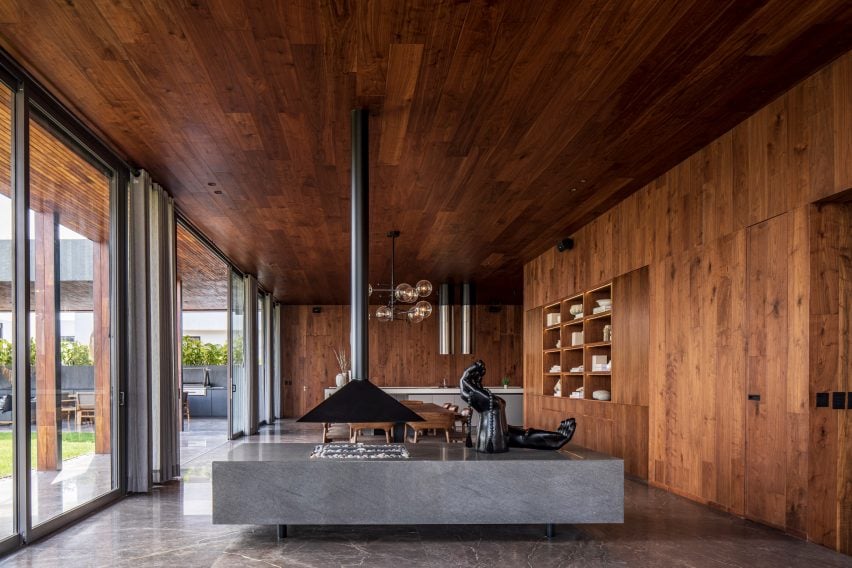 Walnut-clad rooms at house by Reims 502