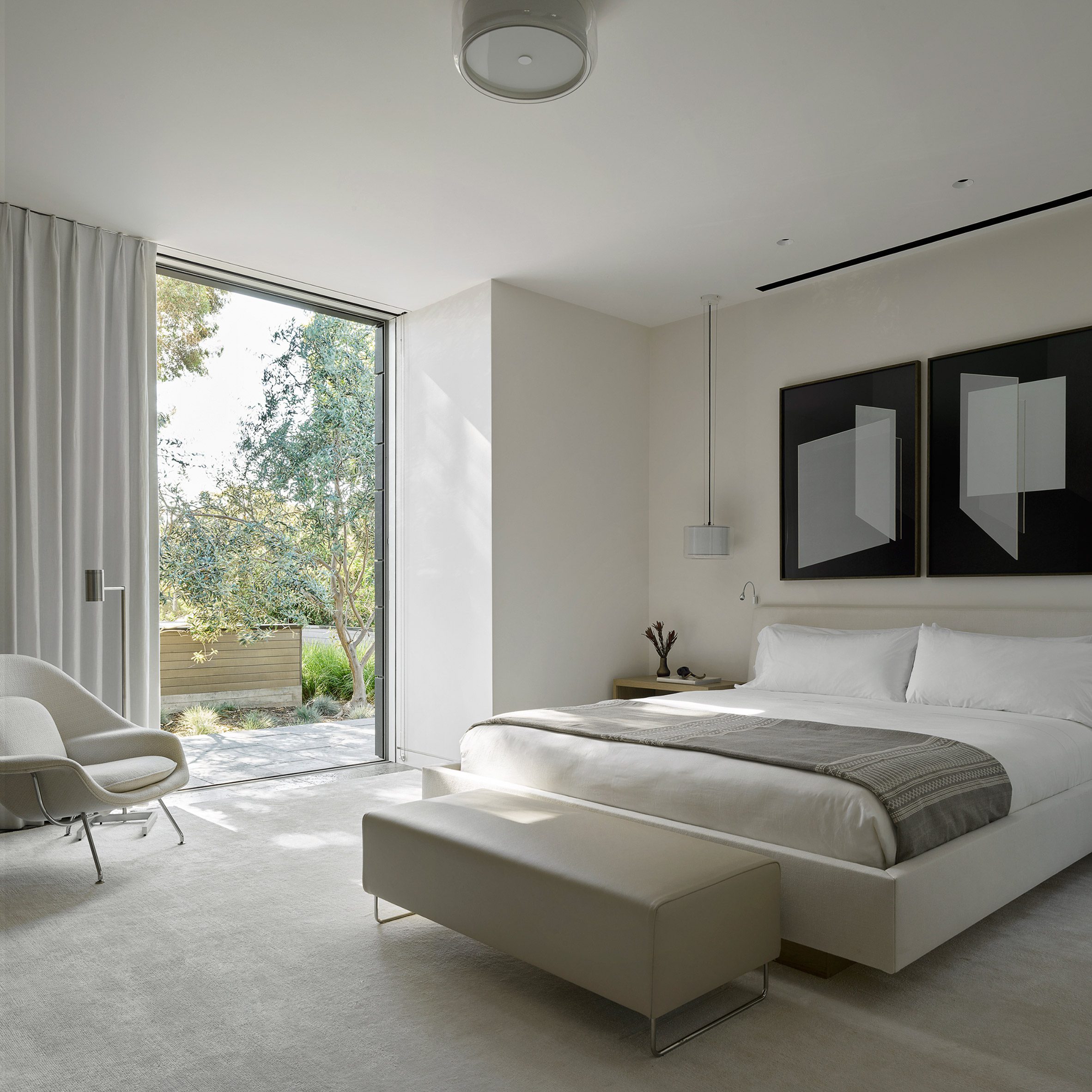 Minimalist bedroom at house by Walker Warner Architects
