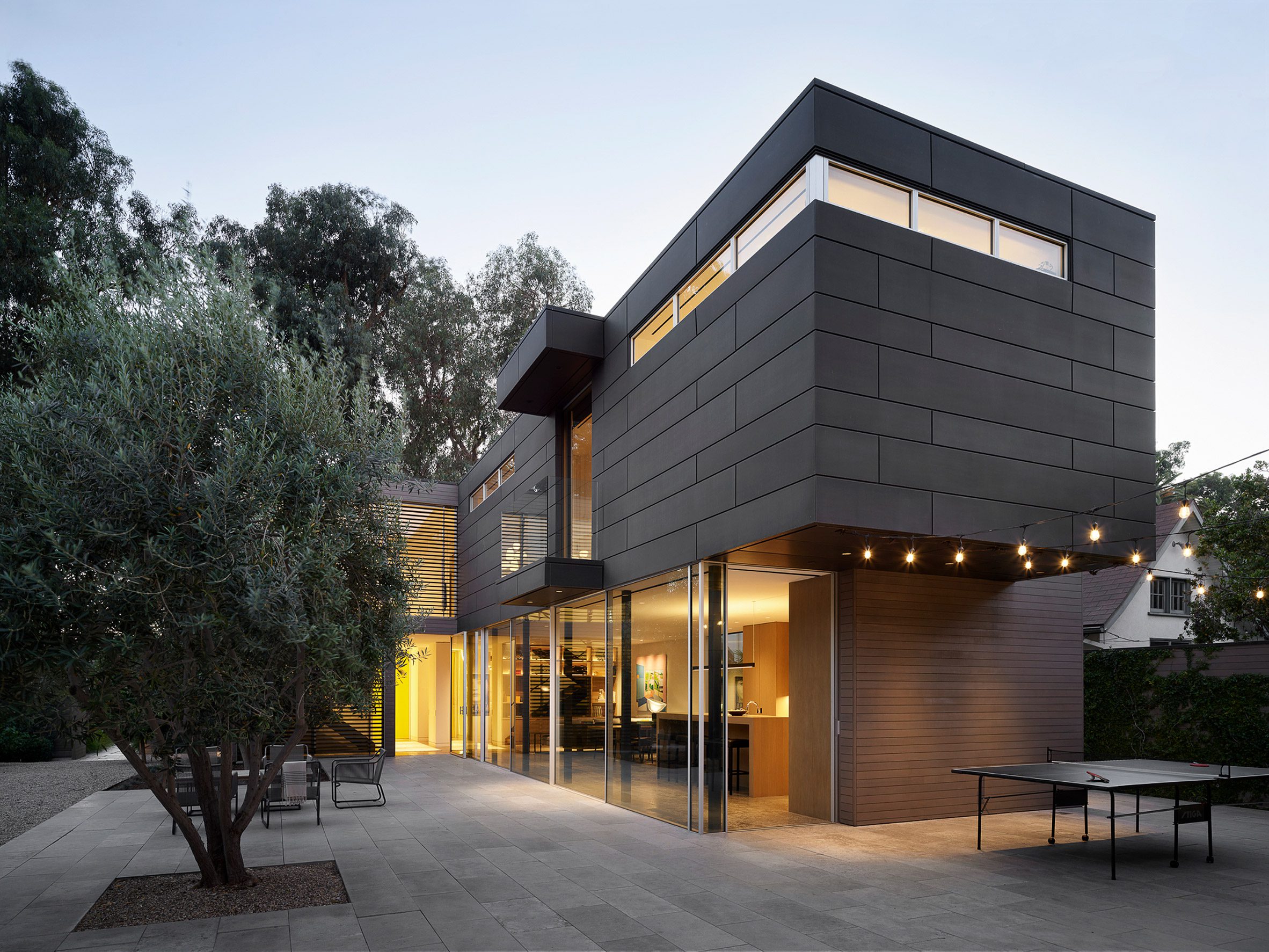 Boxy residential volume with sliding glass doors 