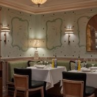 Restaurant interior with ceiling moulding and green decorative walls