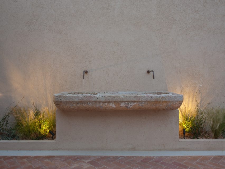 Rough stone basin outside hotel in Mallorca by Único Hotels and interior designer Pilar García-Nieto