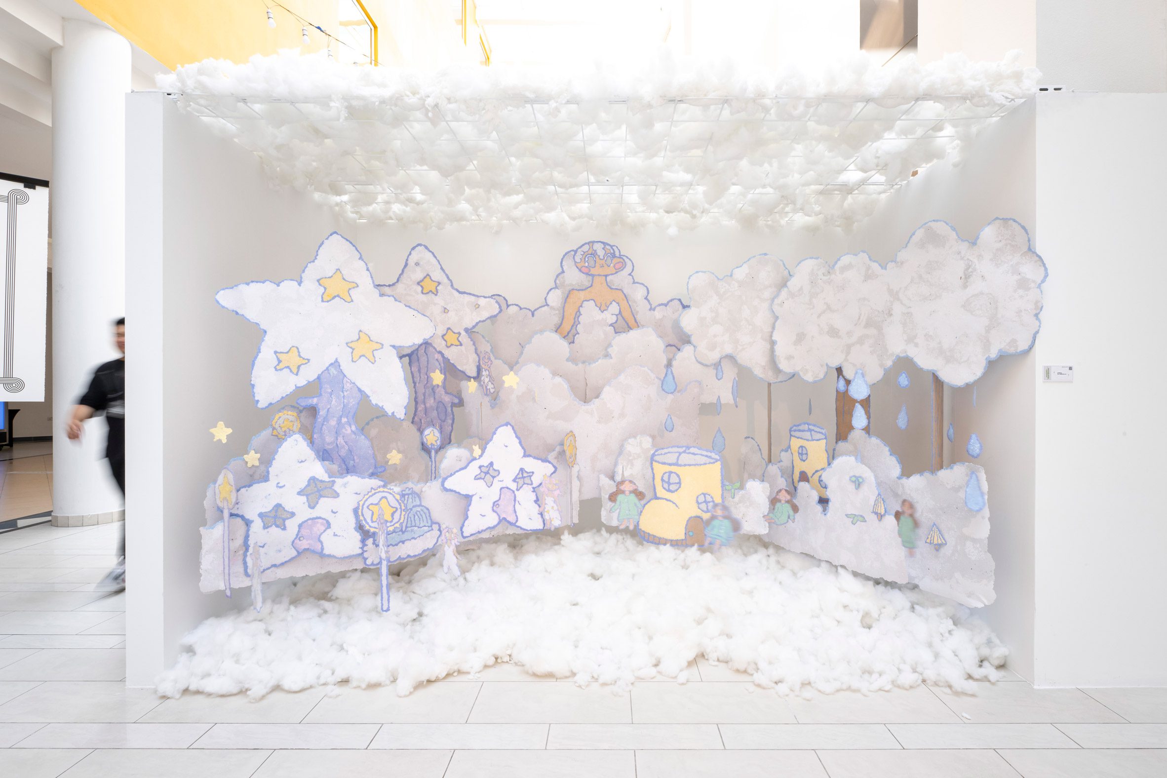 A student installation display with fluffy white clouds and cartoon cut-out star characters