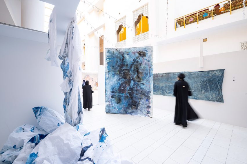 An exhibition of student design work in a white gallery by Virginia Commonwealth University