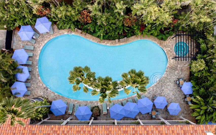 Aerial view of a kidney-shaped outdoor swimming pool