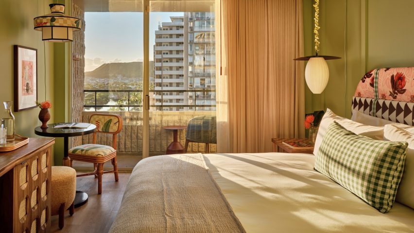 Hotel bedroom at sunset with view of Honolulu