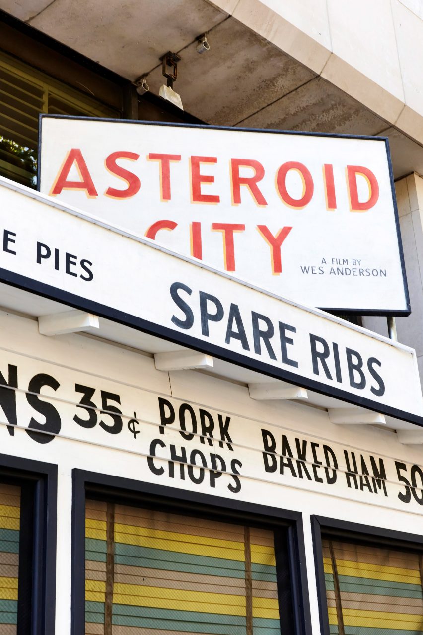 Exterior sign post for the Asteroid City exhibition at 180 The Strand