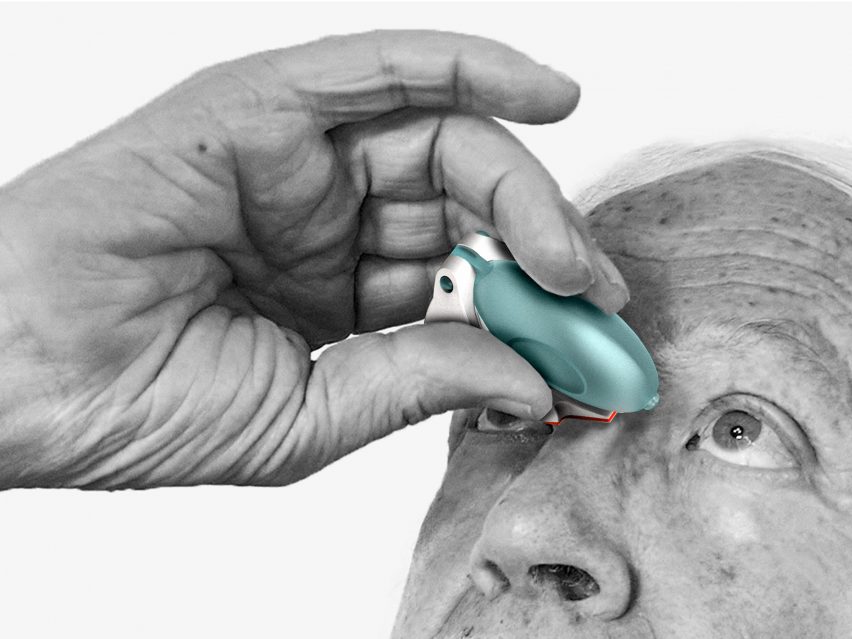 Pensioner dropping medication into eyes with blue-green device