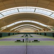 Hopkins Architects tops Wimbledon tennis courts with sweeping racket-informed roof