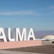 A large sign that says ALMA in front of a dome