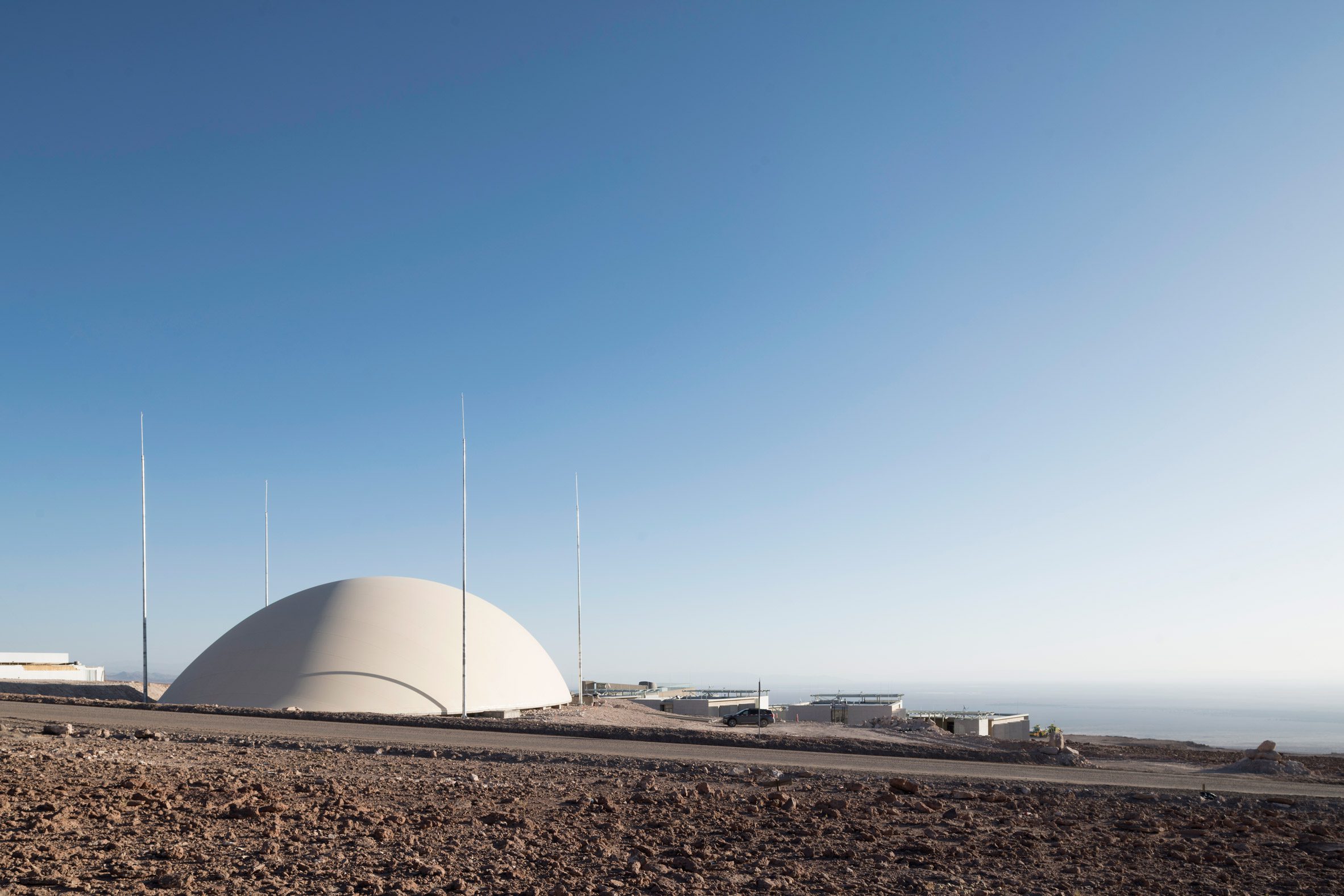 A domed sports facility overlooking the desert in Chile