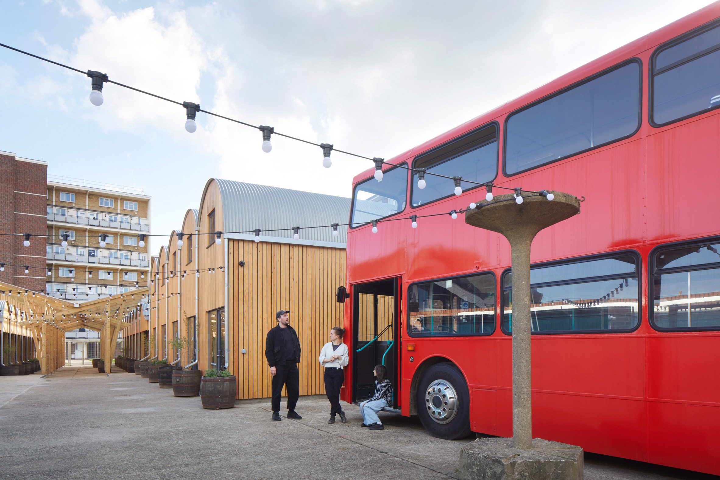 London bus at Angel Yard by Jan Kattein Architects