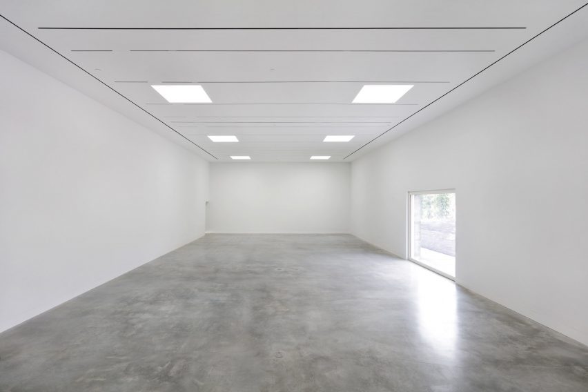 Polished concrete floors and white ceilings