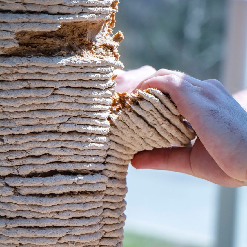 Hands peeling a column of 3D printed sawdust