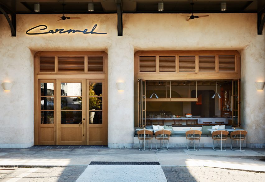 Carmel exterior with seating below an open window
