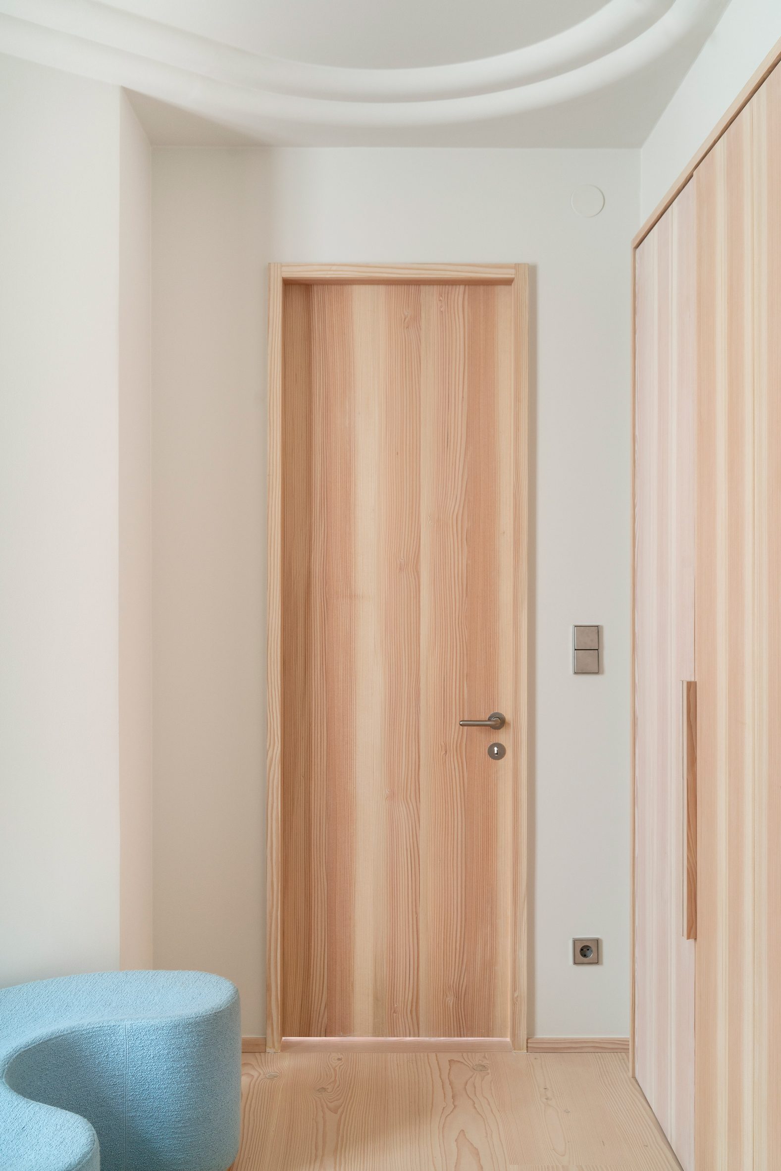 Hallway of Stockholm apartment by Note Design Studio with wooden door