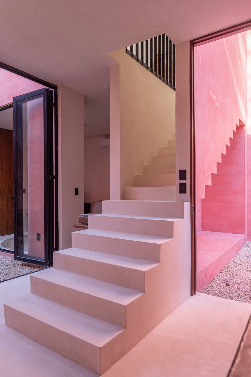 Blocky pink staircase within house 