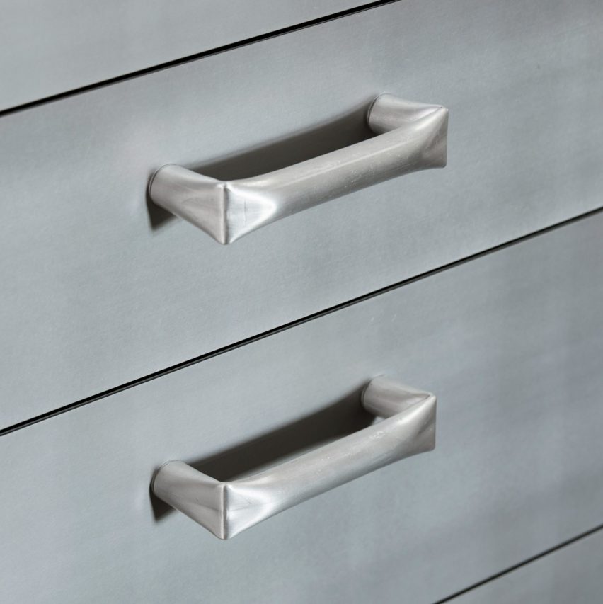 Silver handles on brushed metal drawer