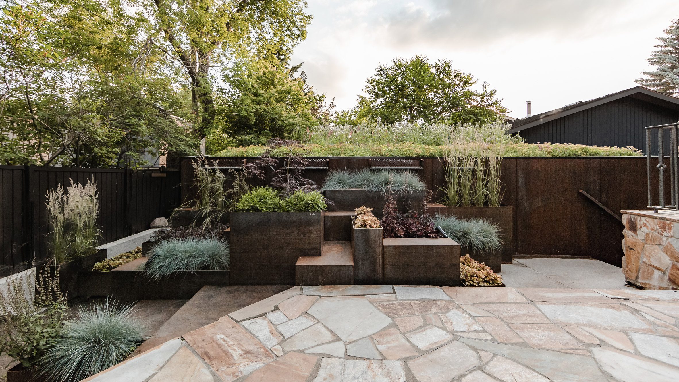 Studio North juxtaposes industrial garage with delicate garden in Calgary - Vimarsana News