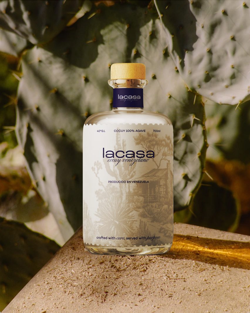 Photograph of liquor bottle in front of cactus plant