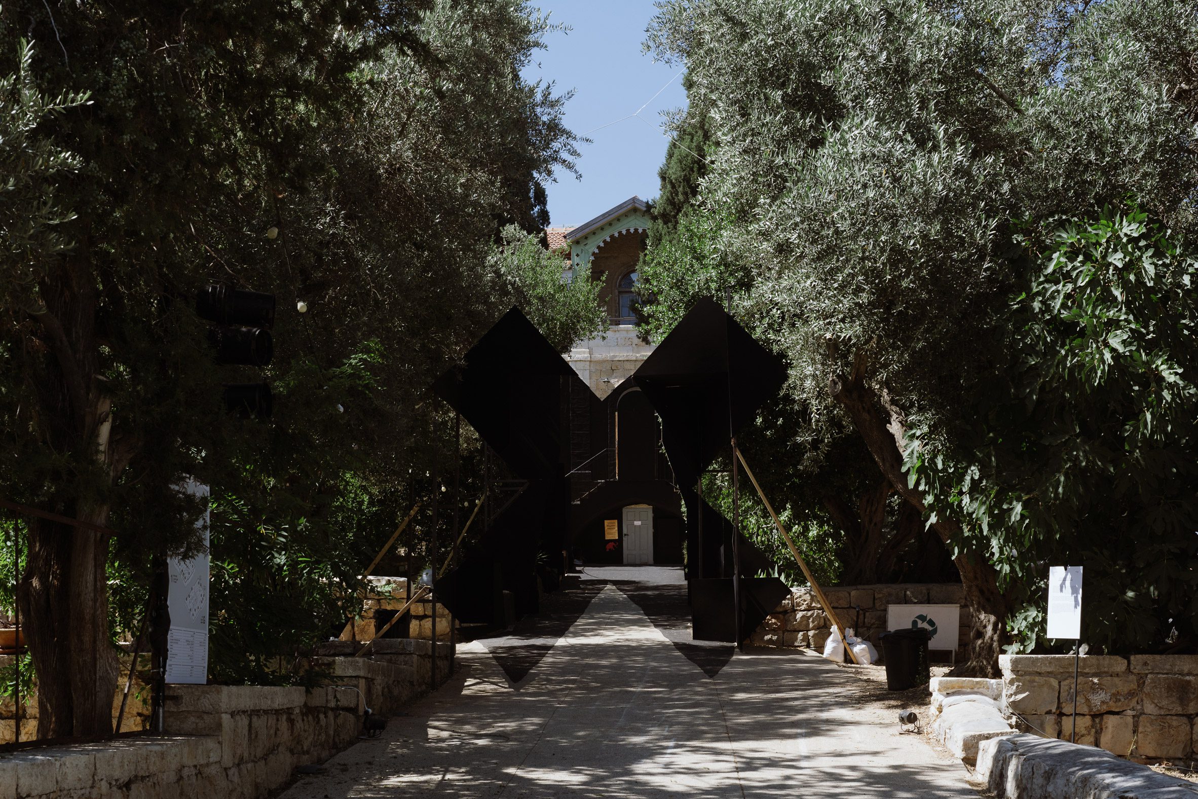 Black X installation in front of Hansen House at Jerusalem Design Week