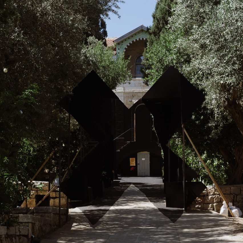 Black X installation in front of Hansen House at Jerusalem Design Week