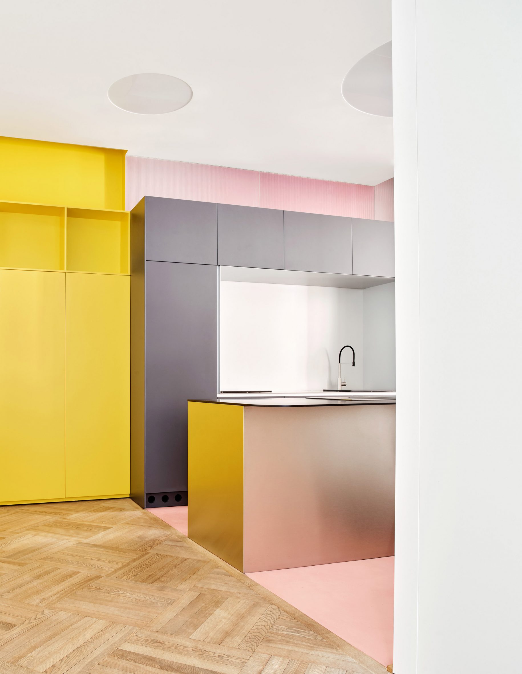 Pink, grey and chrome Kitchen in JJ16 apartment by Lucas y Hernández-Gil