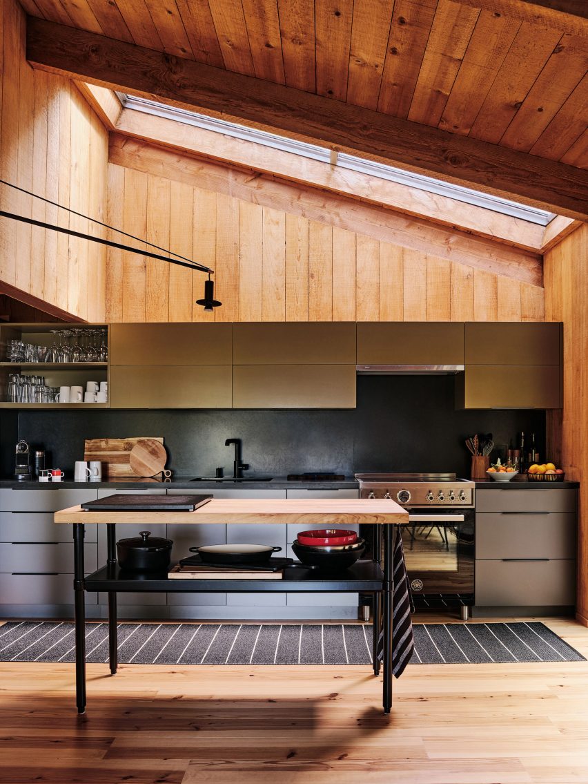 Contemporary kitchen with wooden accents by Joanne Koch