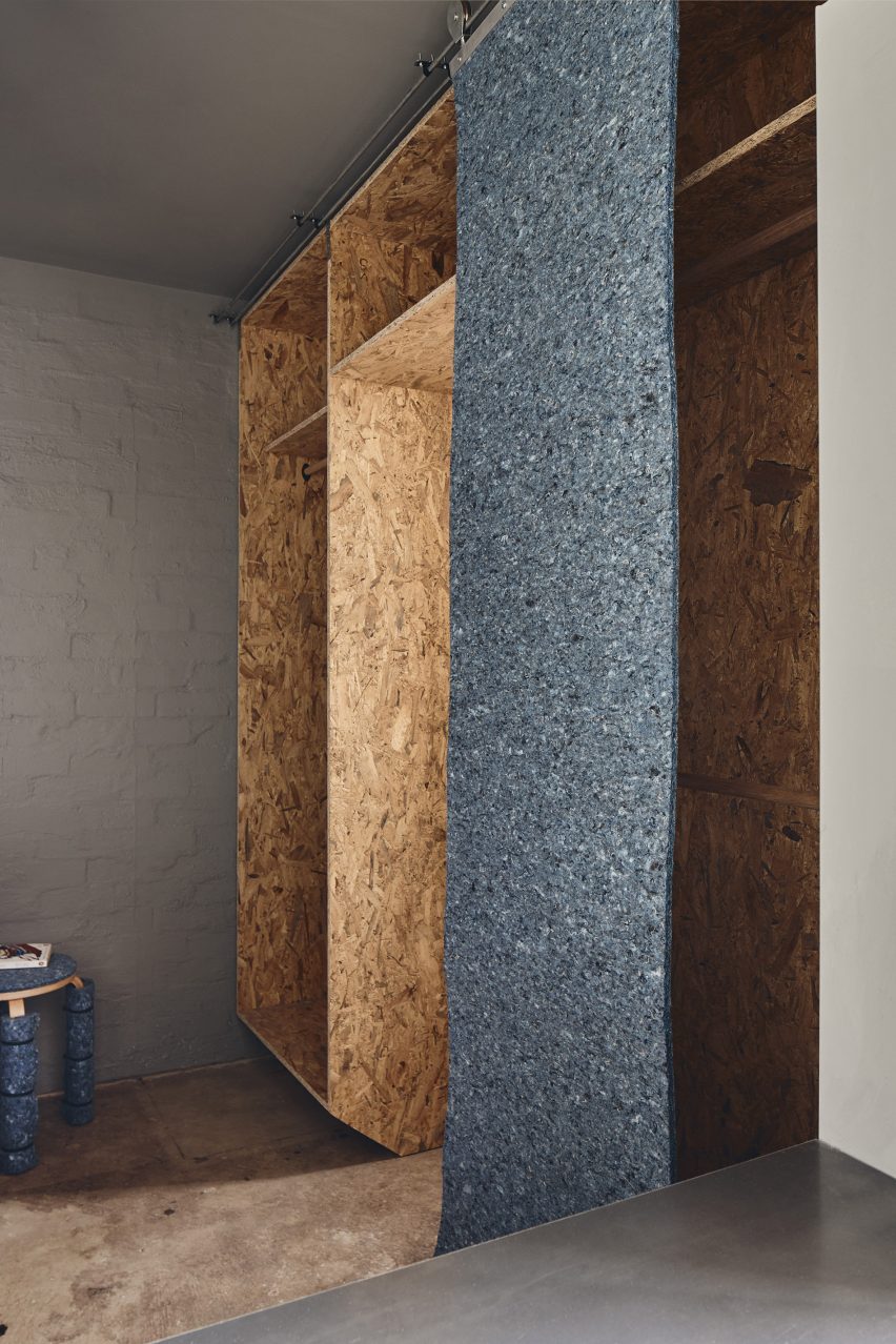 Chipboard and recycled denim storage unit in bedroom of Microloft apartment