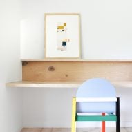 Office nook with a custom-built wood desk and colourful chair