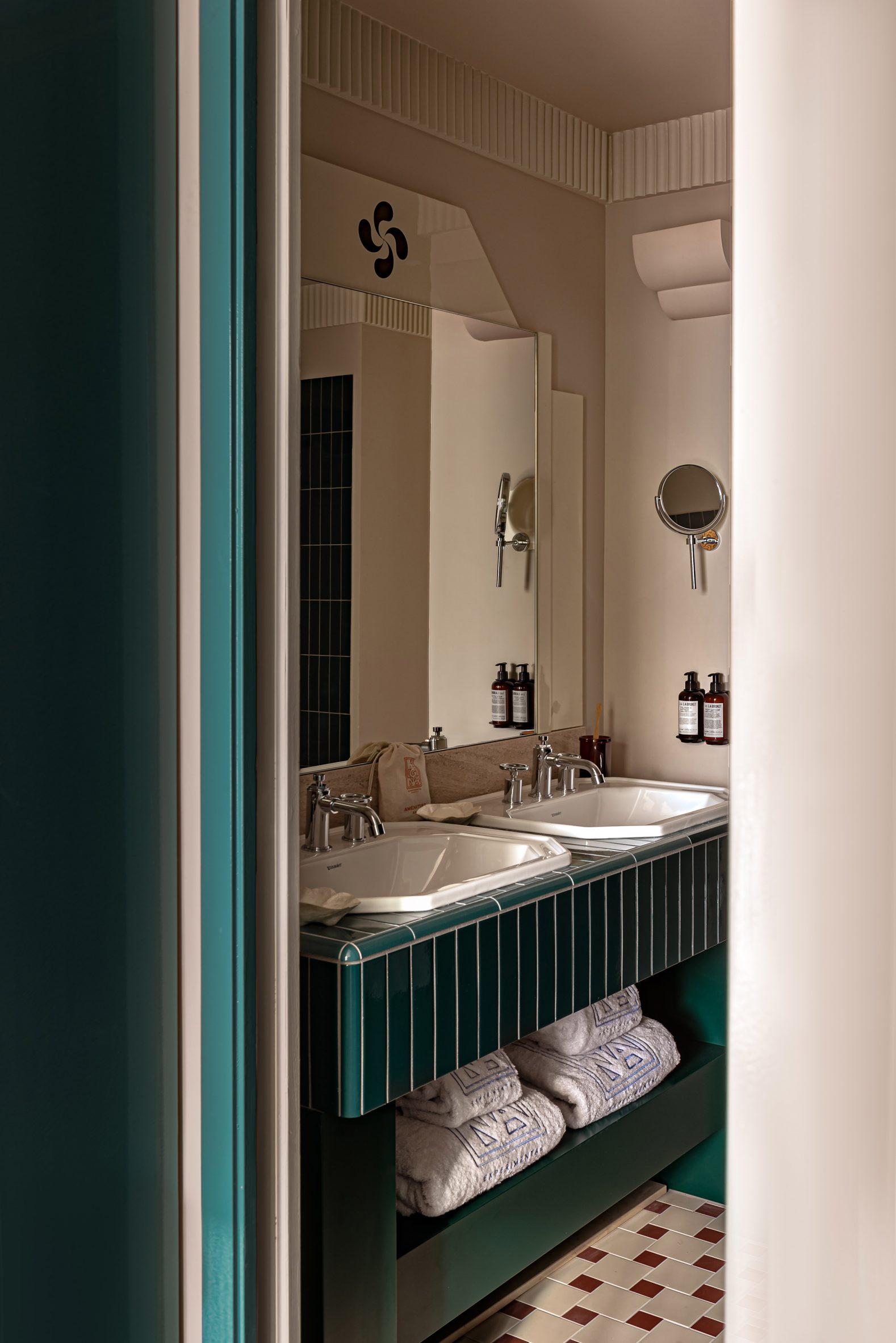 Bathroom with teal-coloured tiles