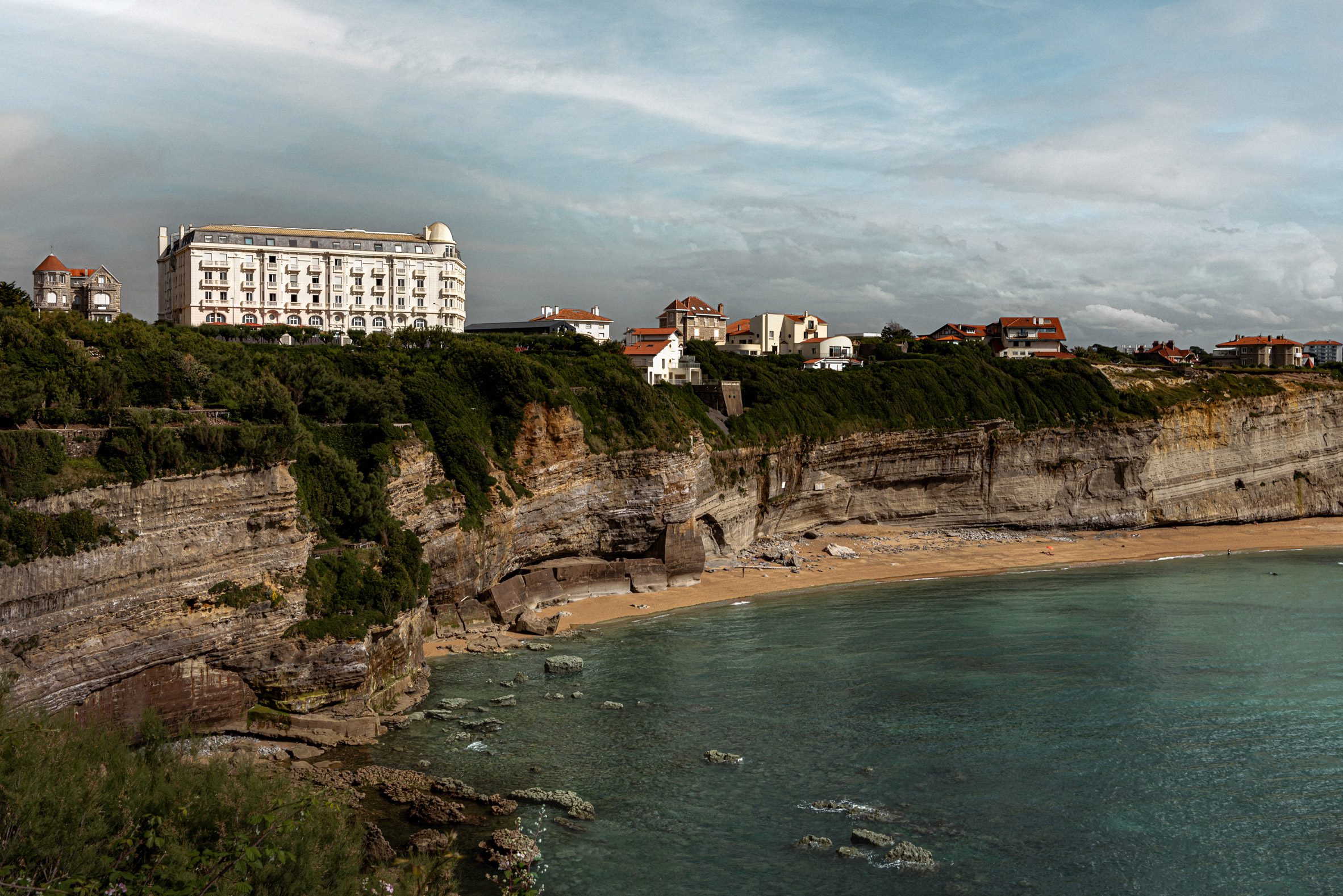Hotel perched on a cliff overlooking the sea