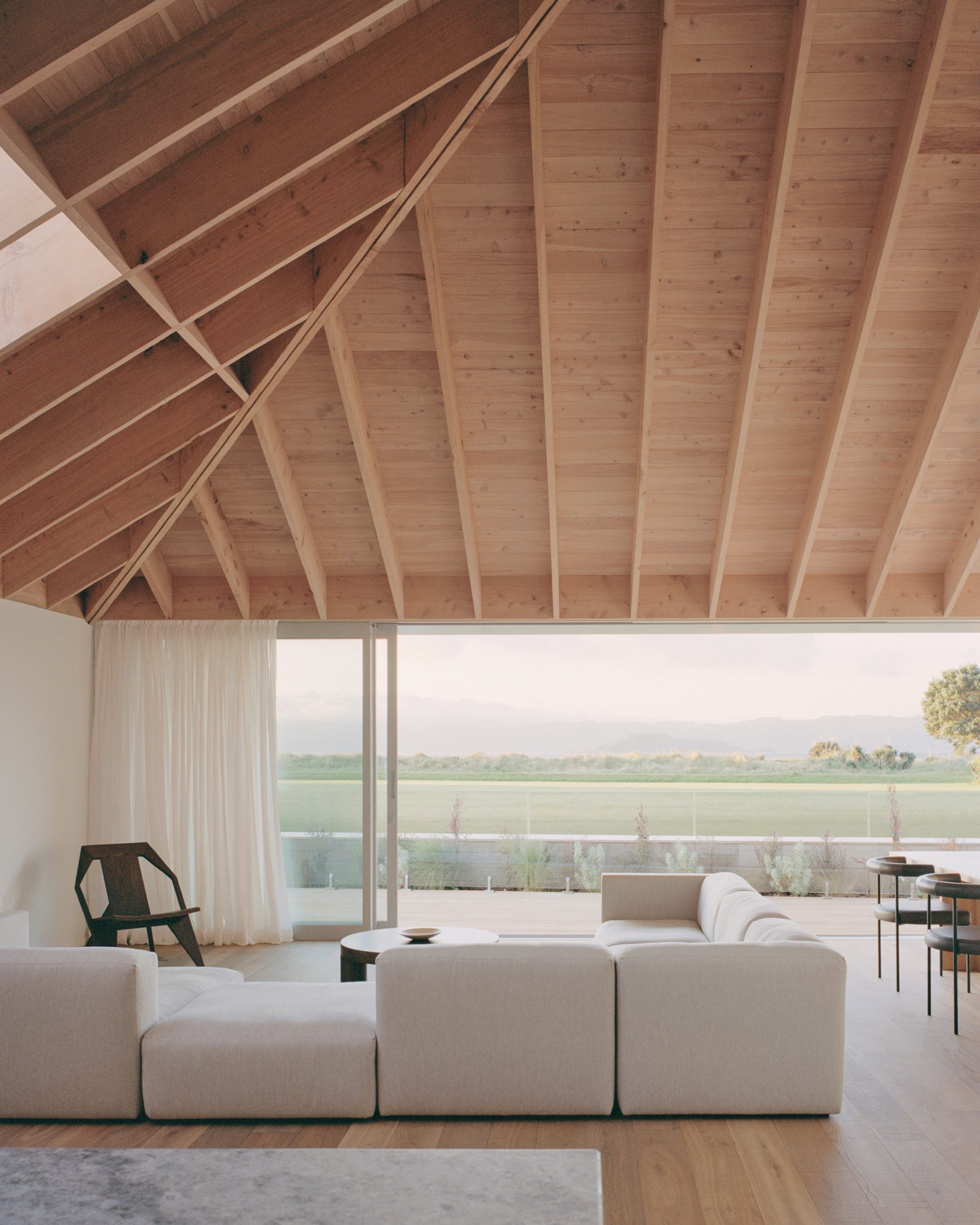 Living room with exposed wooden roof