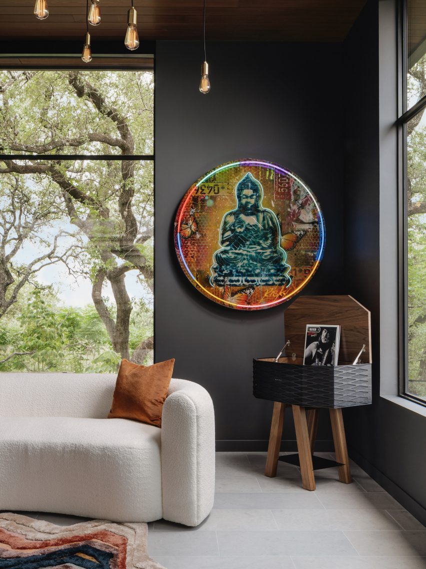 Neon Buddha artwork in master bedroom 