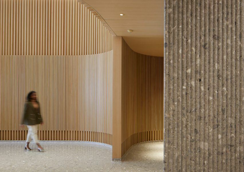 Wooden louvres and terr،o in office lobby