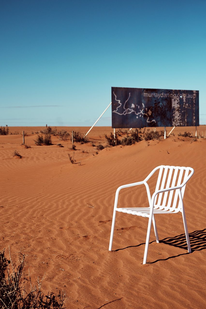 White chair in outback by billboard
