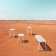 White seating on orange earth in outback