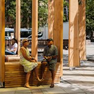 Two people sat on Studio Bark installation Leeds