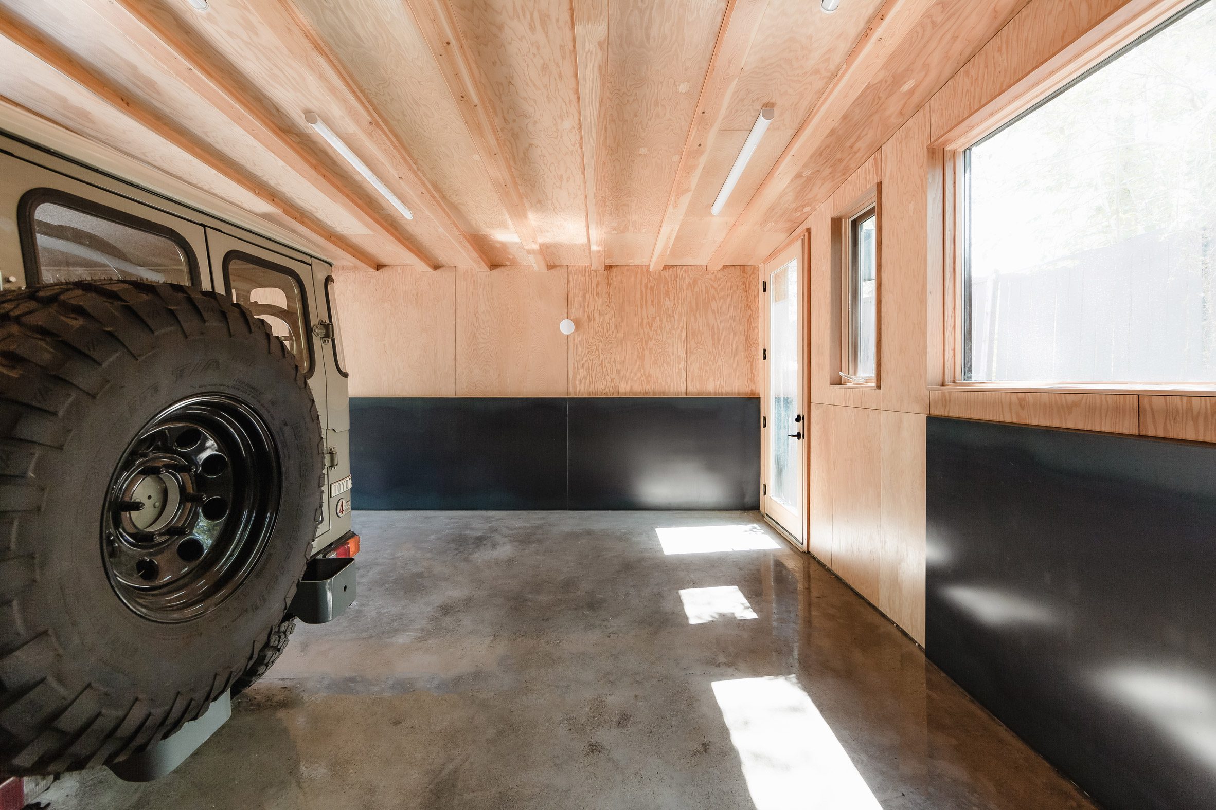 Two-tone wooden walls within garage