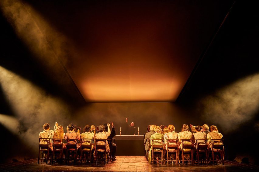 An orderly arrangement of chairs on stage in The Crucible