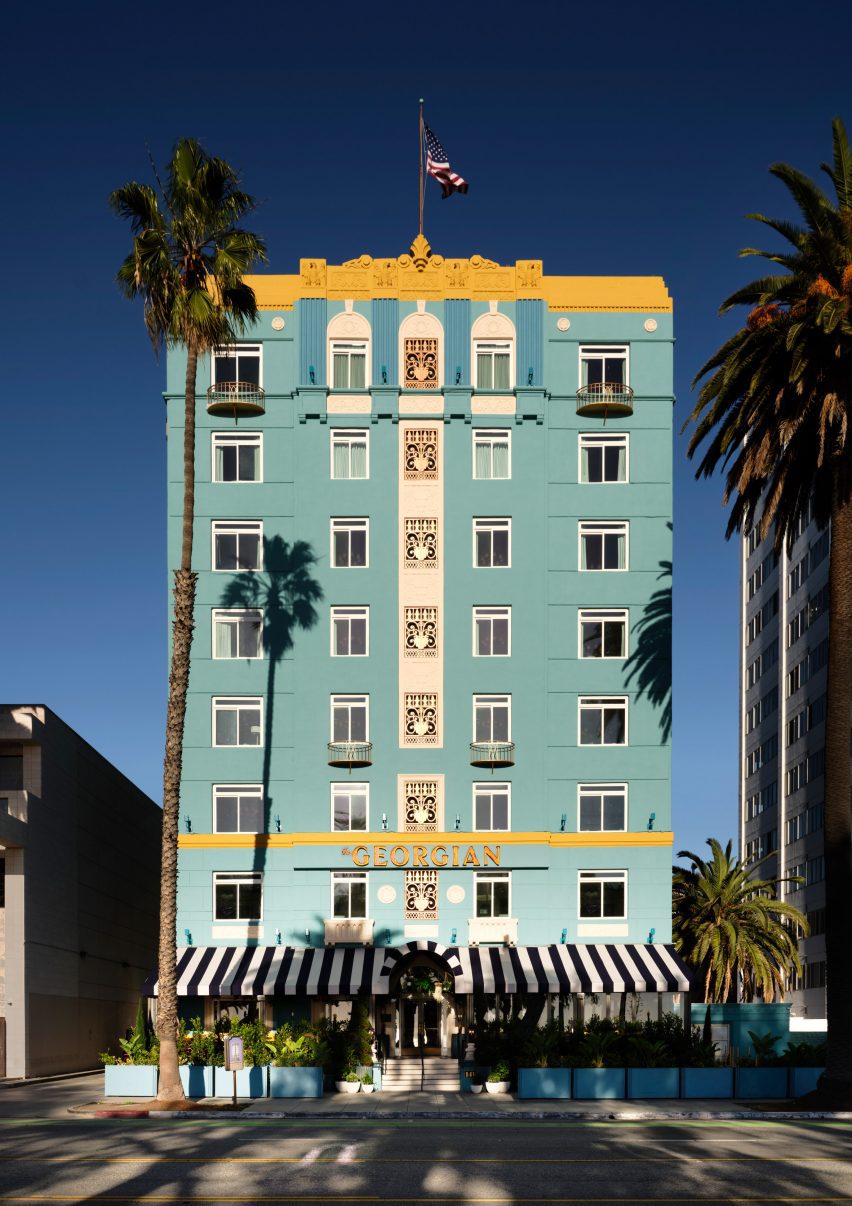 Exterior of eight-storey art deco building with turquoise facade