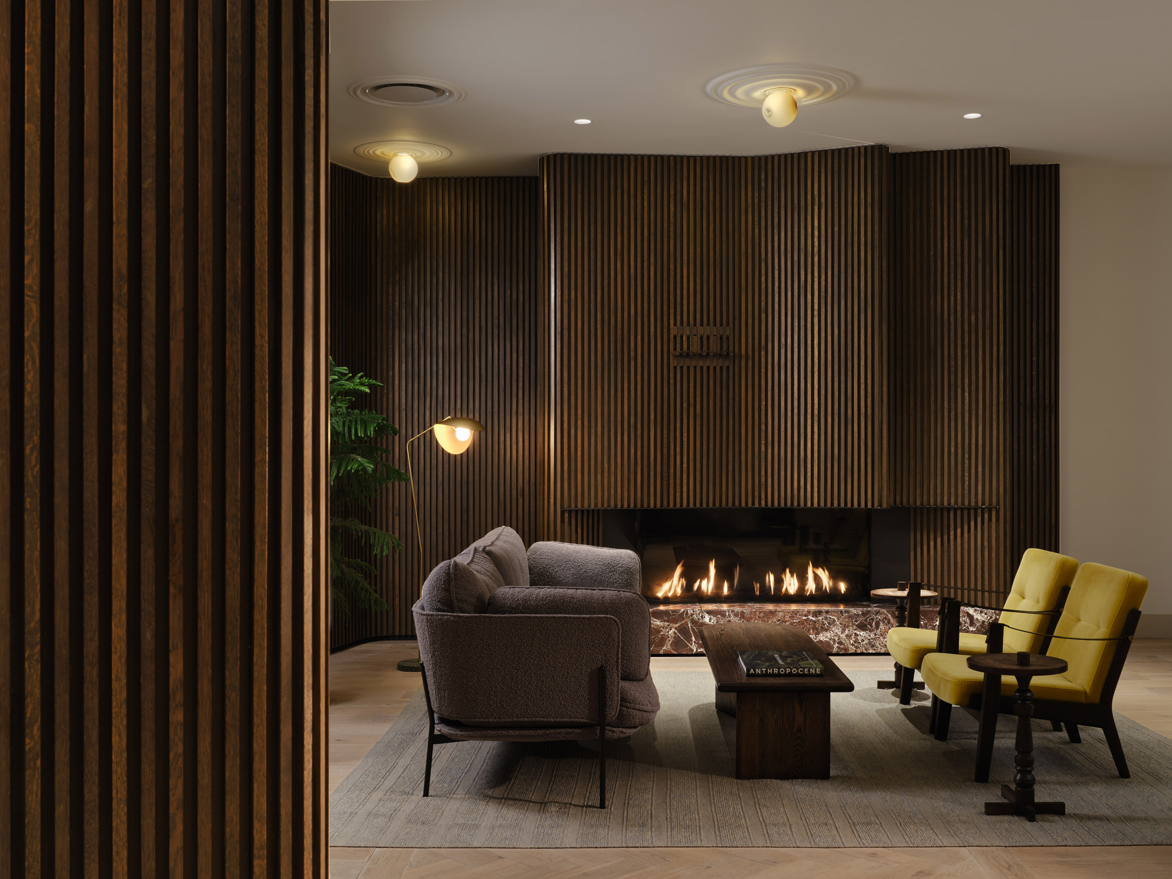 Cosy lounge with dark tambour fireplace surround
