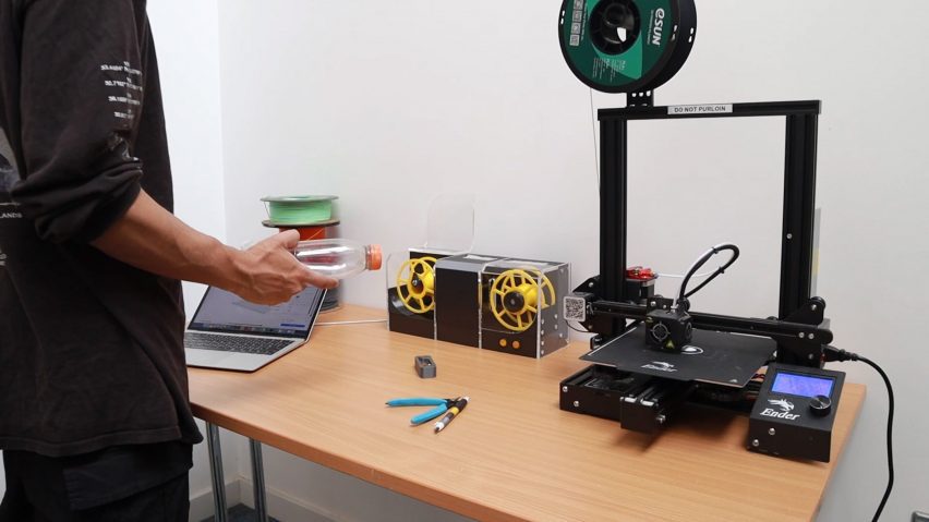Photograph of a PET filament extruder connected to a 3D printer on a desk