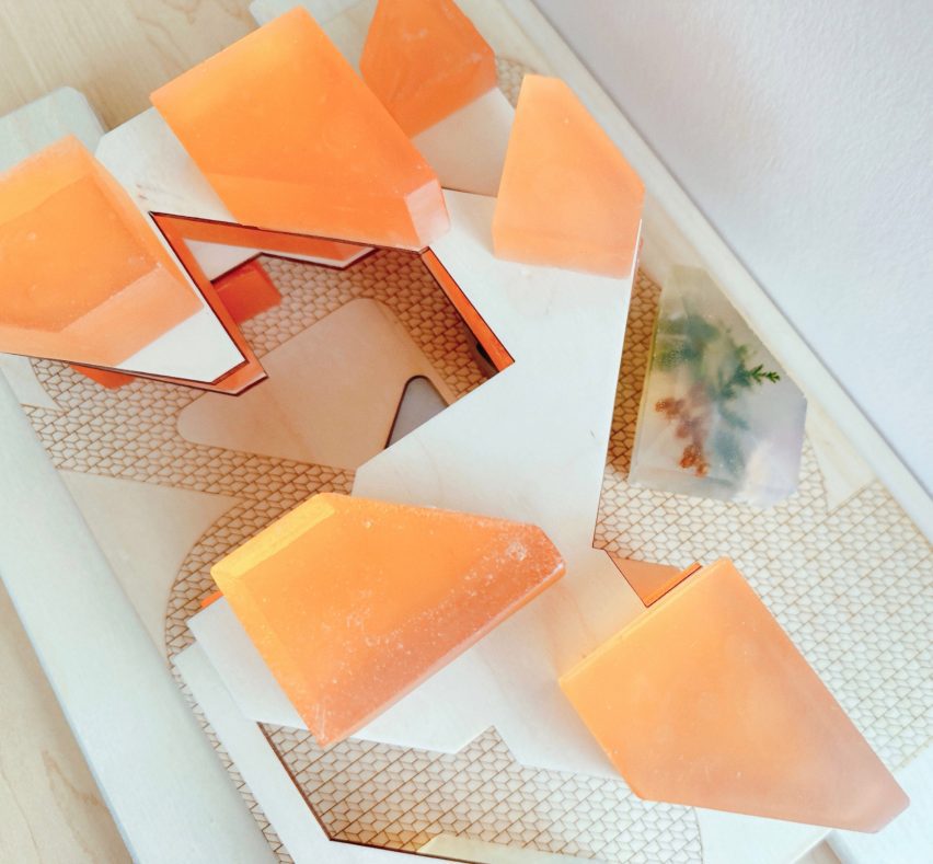 Photograph of model with peach-coloured blocks