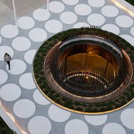 A circular sculptural that surrounds the atruium of a light well