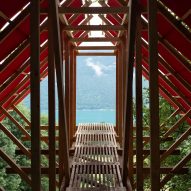 Oversized red roof shelters Patagonian Shadow Cabin in France